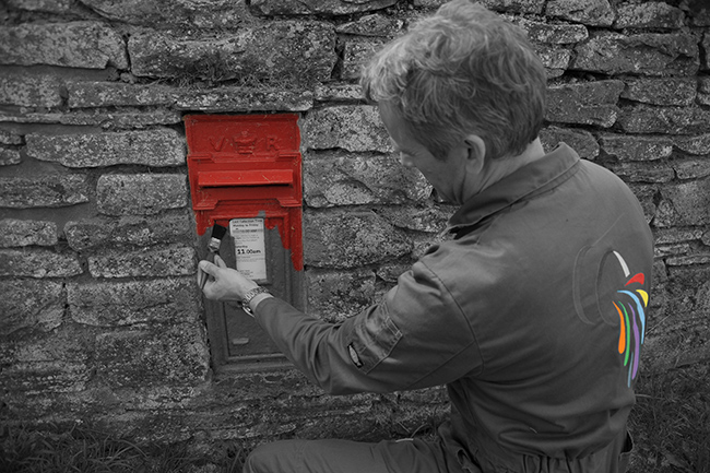 A colourman from Colour Control Paints a letter box